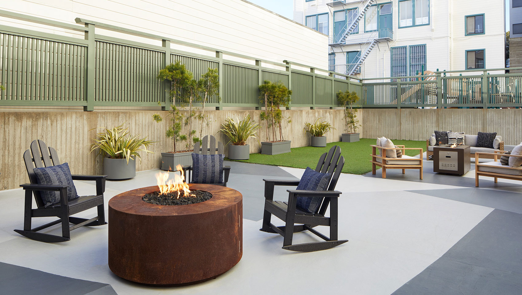 courtyard with firepits and lounge chairs