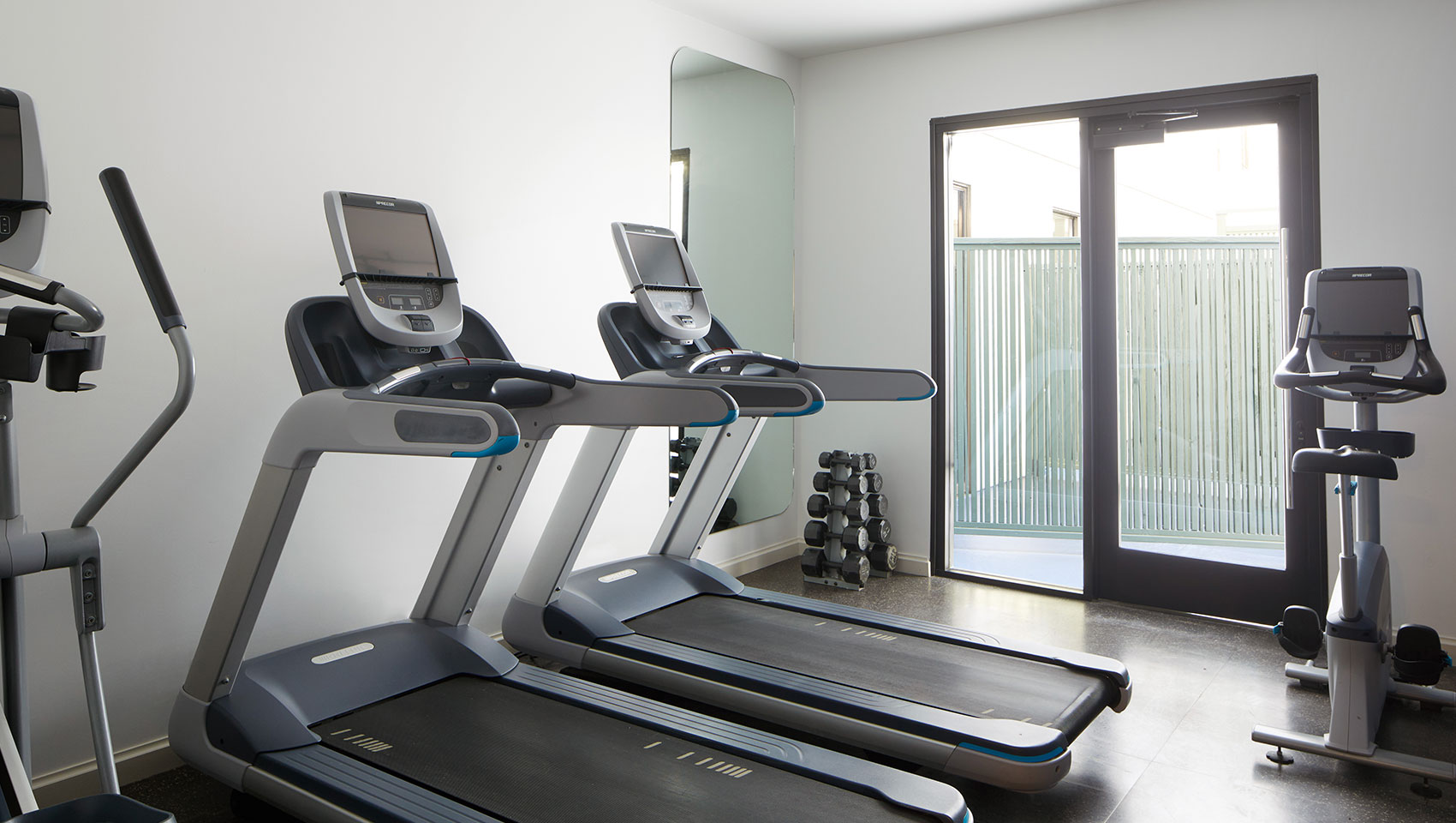room with elliptical and treadmill